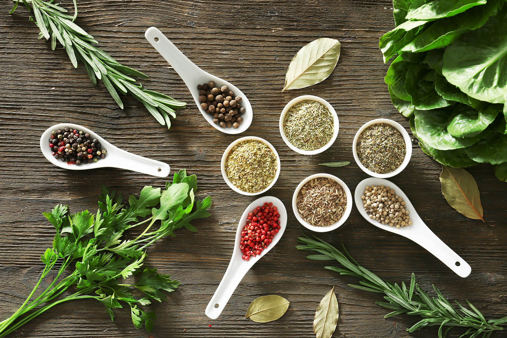 Fresh natural herbs and spices on wooden background — clean ingredients